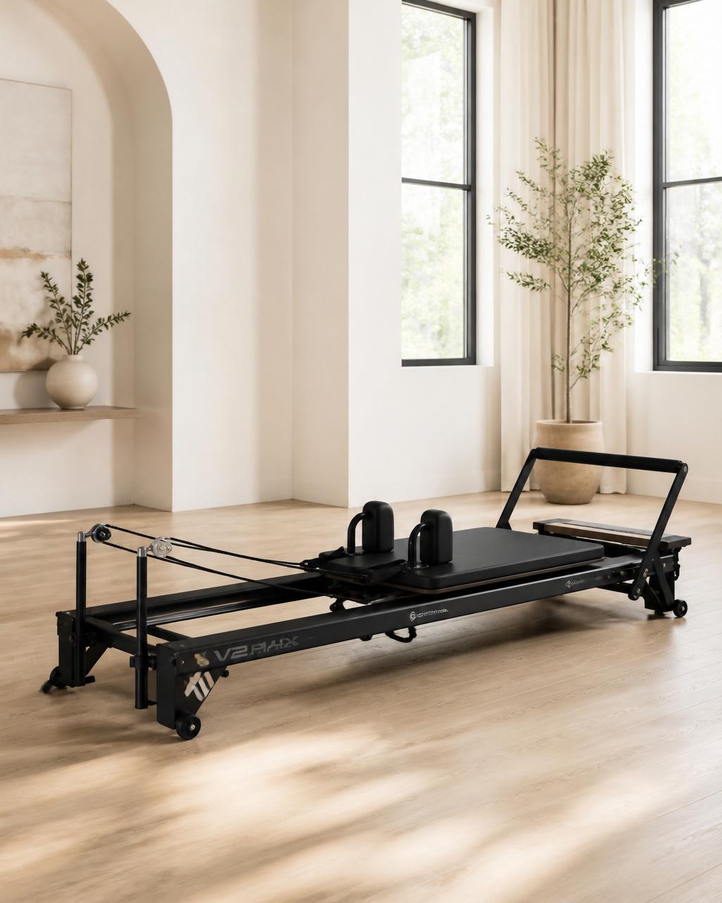 Black Onyx Merrithew V2 Max Reformer in a bright studio
